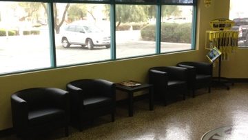 Customer lounge with leather chairs and big windows at Yota Pros in Tempe