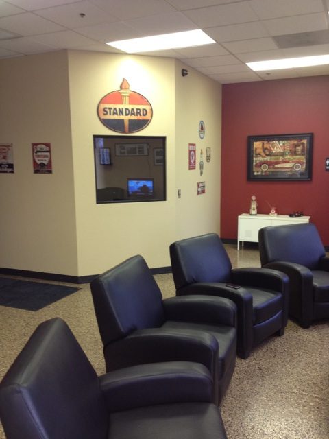 Leather chairs and a TV in the Yota Pros lounge