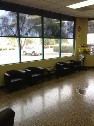 Customer lounge with leather chairs and big windows