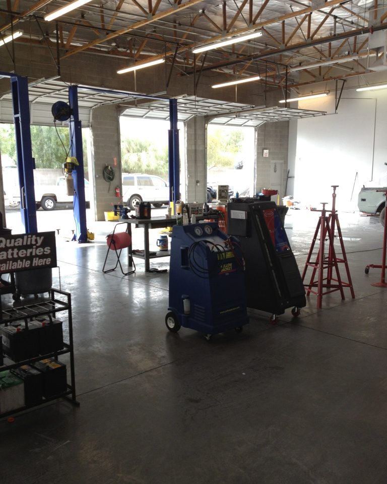 Open service bays with lifts at Yota Pros