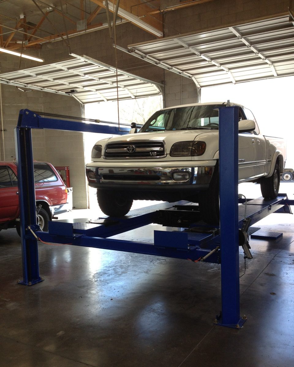 Toyota Tundra on a lift inside the Yota Pros shop in Tempe